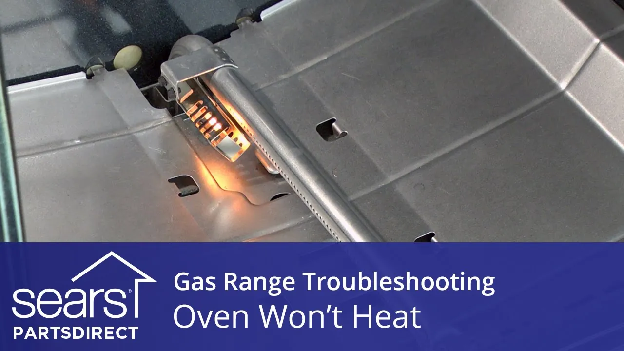 Clean oven interior with a drip pan and cleaning supplies nearby