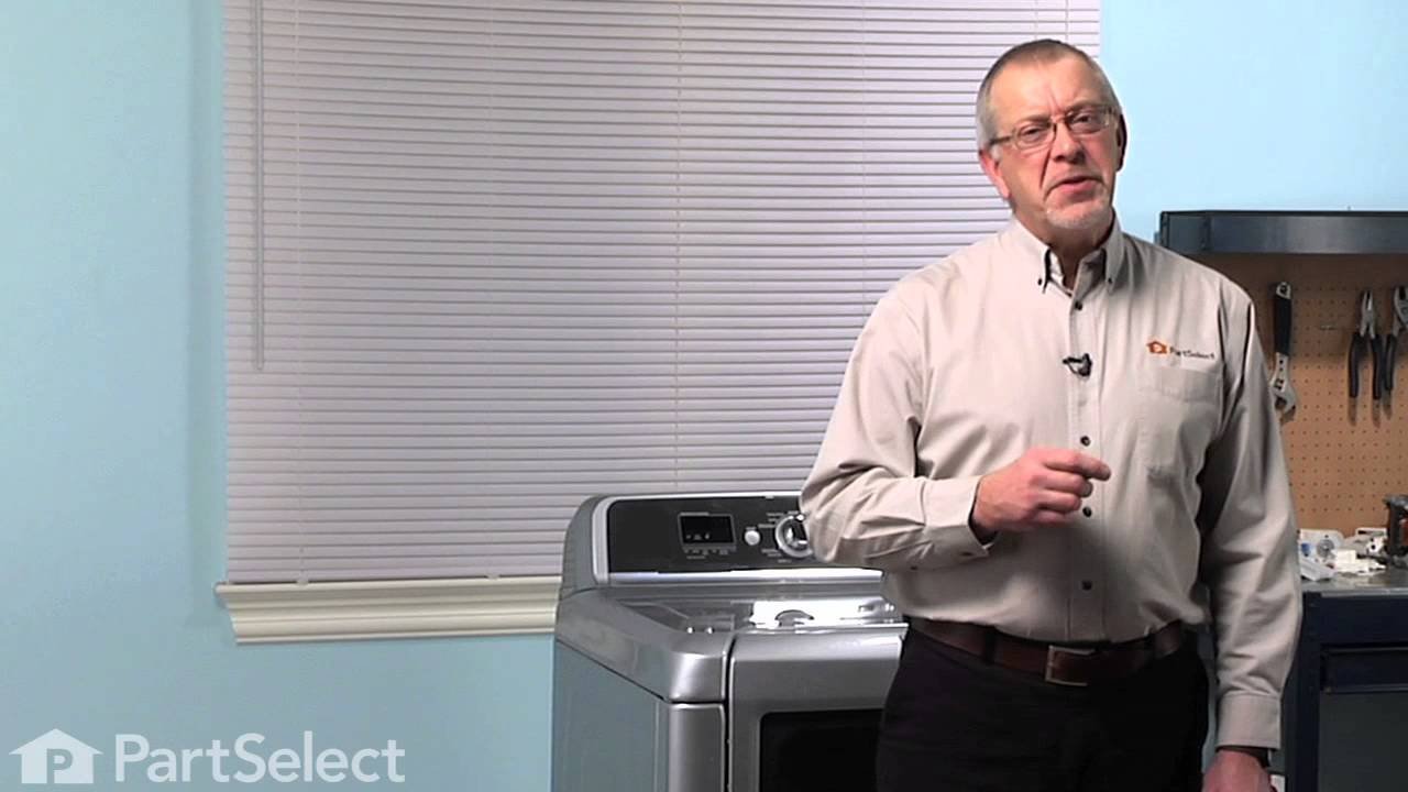 Closed front-loading washing machine door in a bright laundry room