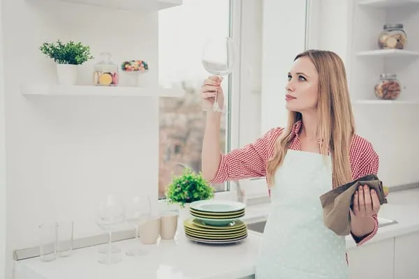 Dishwasher detergent pod and rinse aid by an open dishwasher