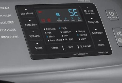 Front-loading washing machine in a bright modern laundry room with a laundry basket