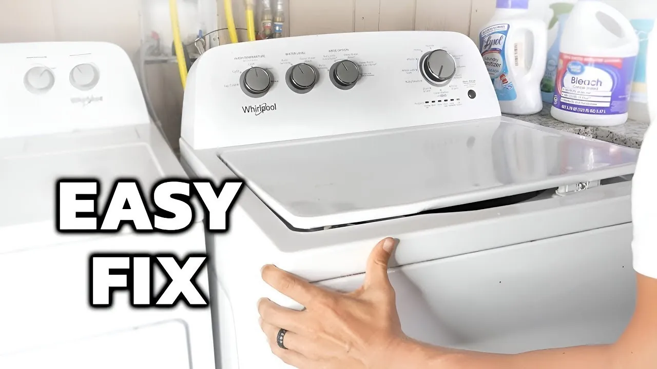 Hand pausing on washer lid before calling for repair help