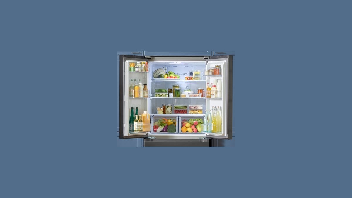 New stainless steel French-door refrigerator in a bright modern kitchen