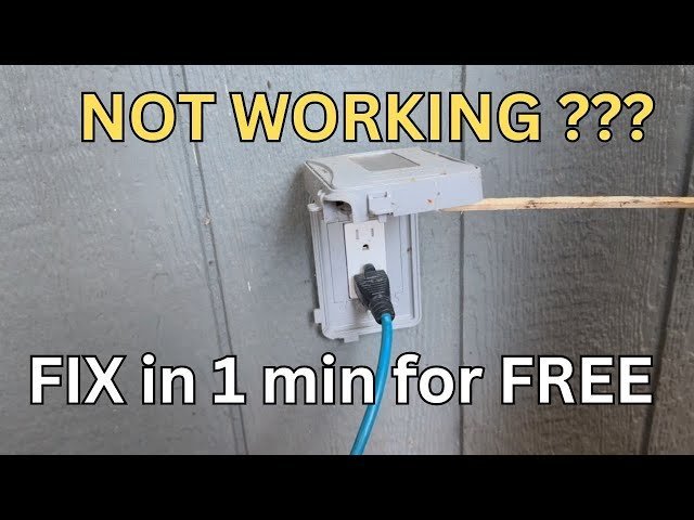 Outdoor power outlet box mounted on a brick wall with cover open