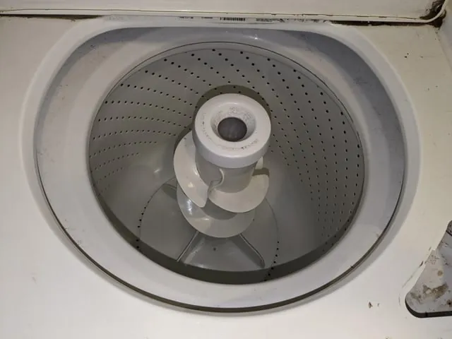 Overloaded washer drum and clogged lint filter screen side by side
