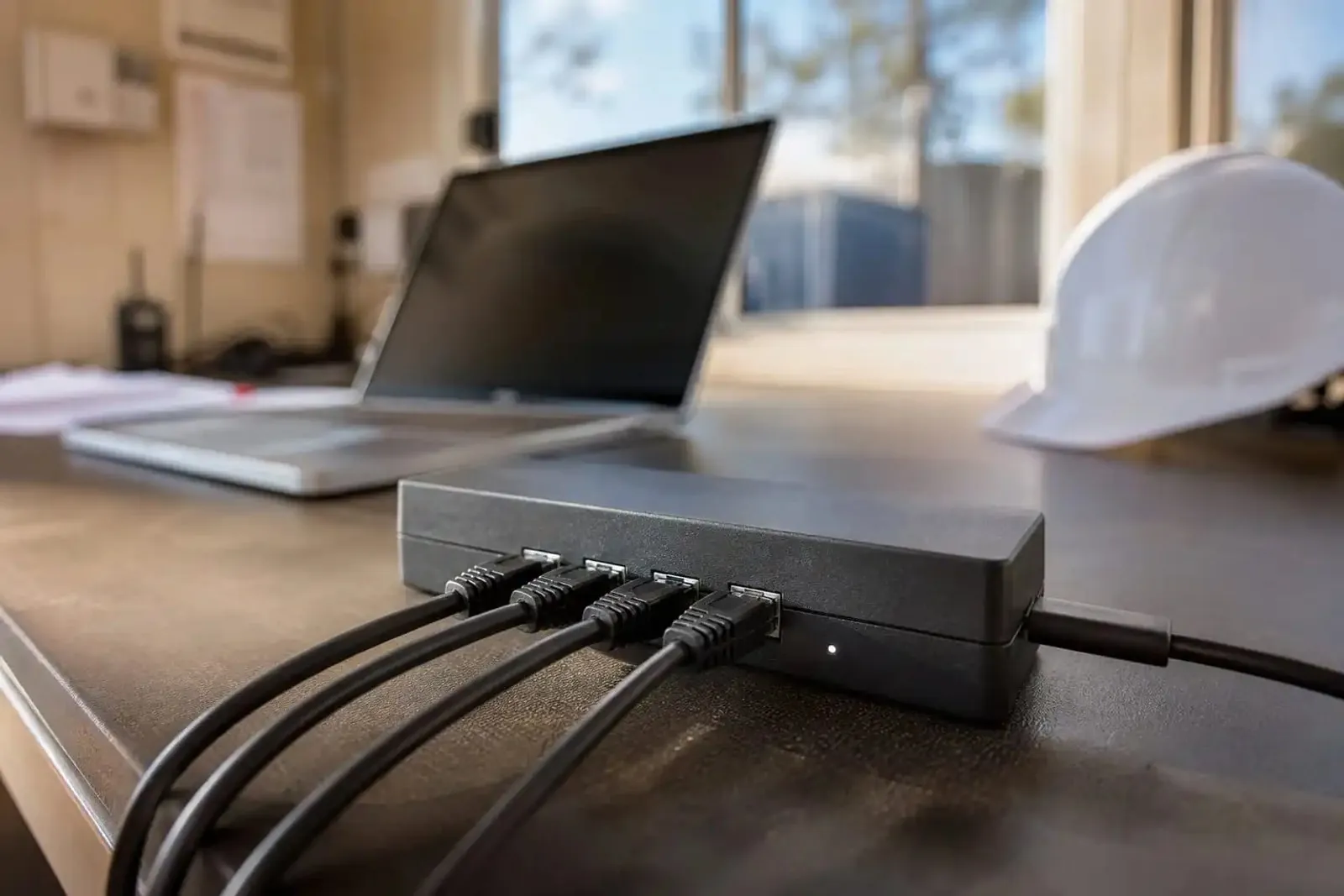 Printer linked to Starlink router with a laptop nearby