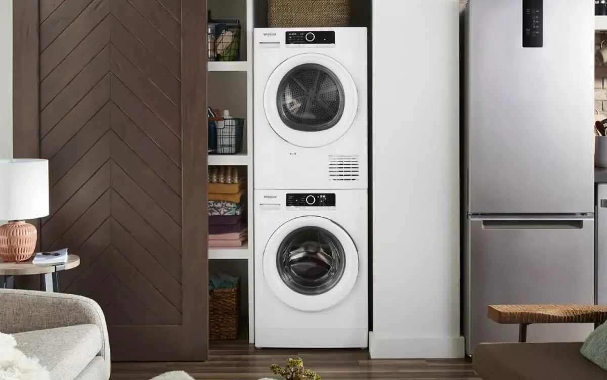 Stackable washer and dryer fitting into a small bathroom corner