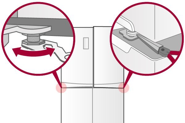 Stainless steel French door refrigerator in a modern kitchen with a wrench nearby