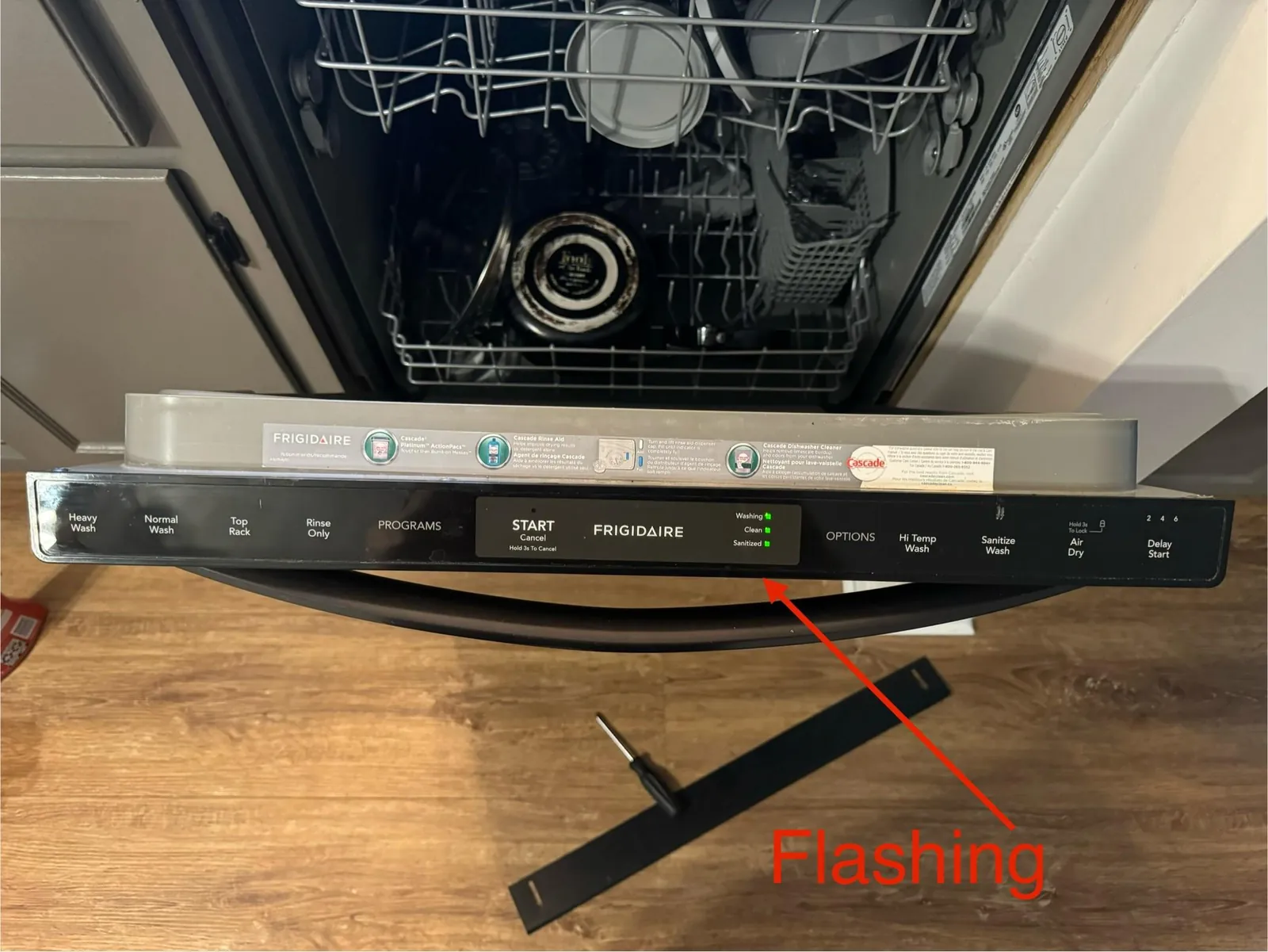 Standing water above the filter inside an open dishwasher