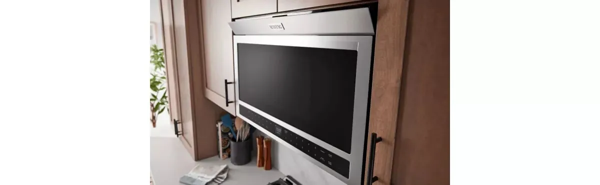 Unplugged microwave with warning tag, call a professional